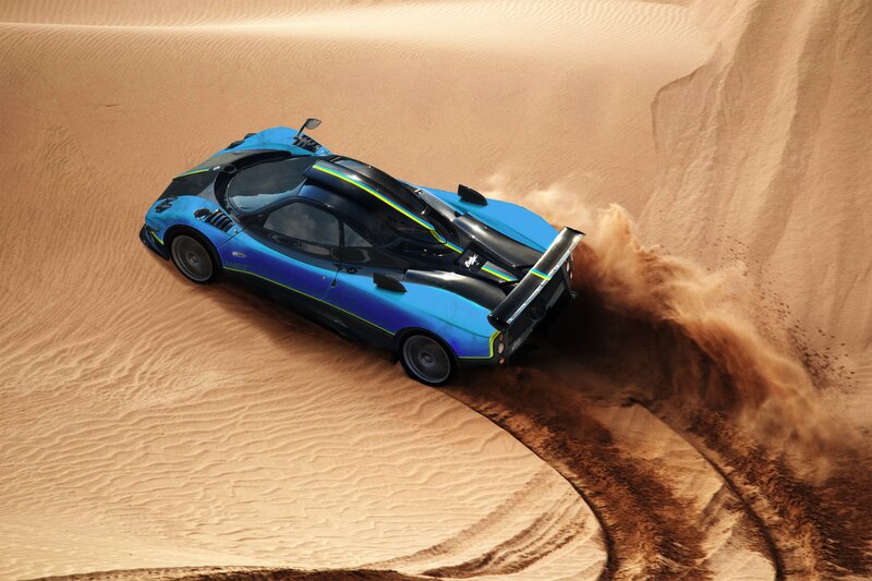 blue sports car in desert