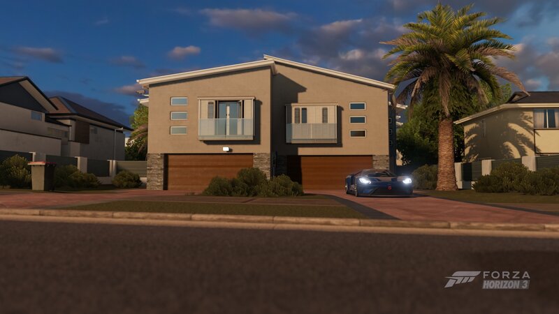 Blue Sports Car in Driveway — Brown