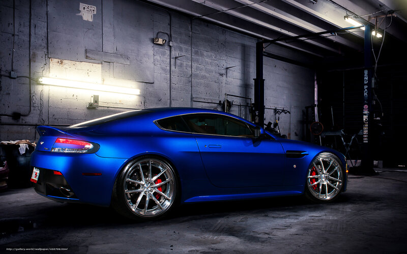 blue sports car in garage