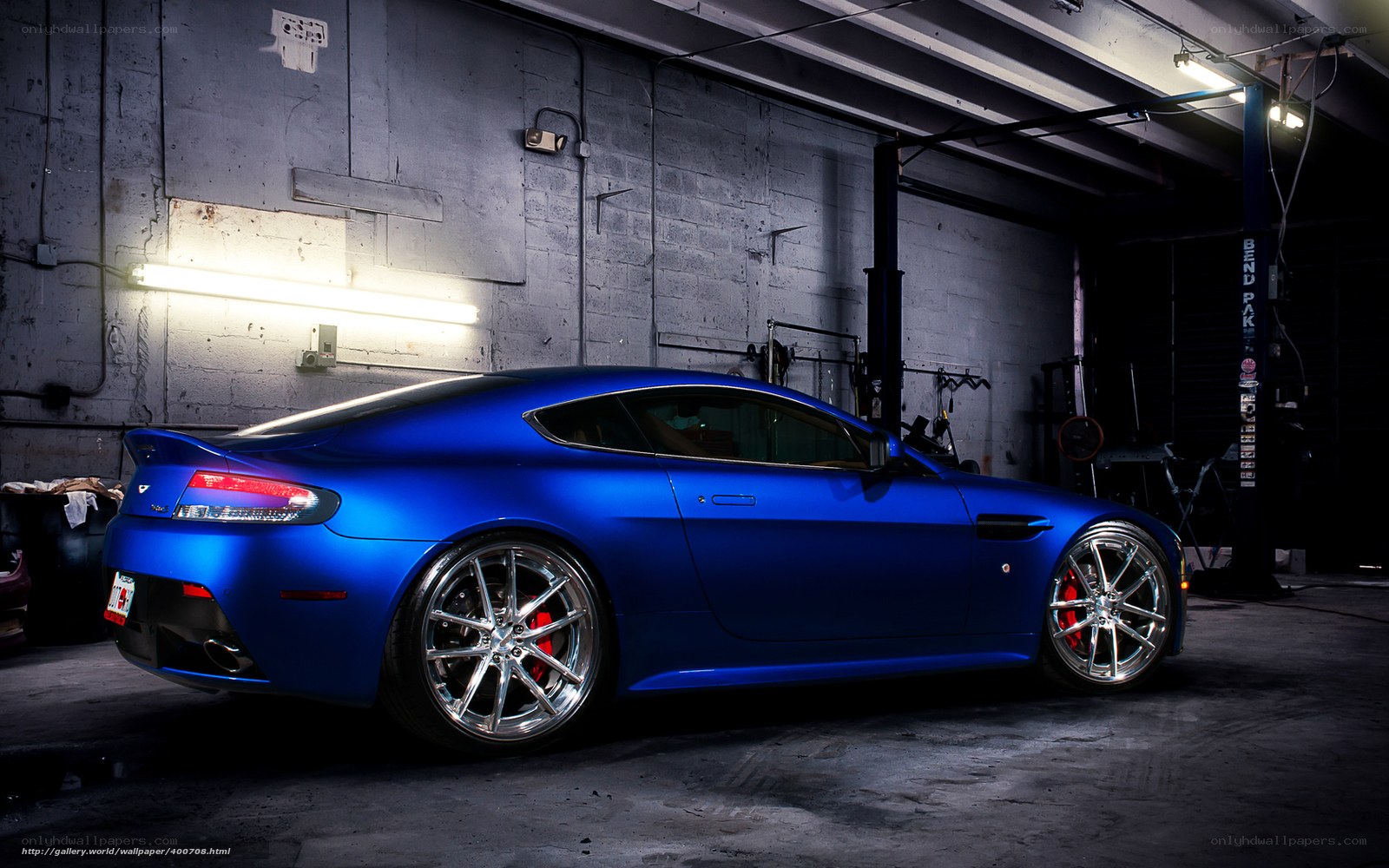 blue sports car in garage