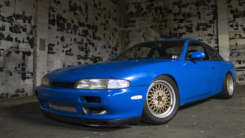 blue sports car in garage
