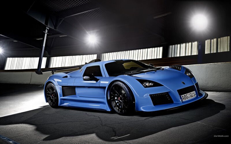 blue sports car in garage
