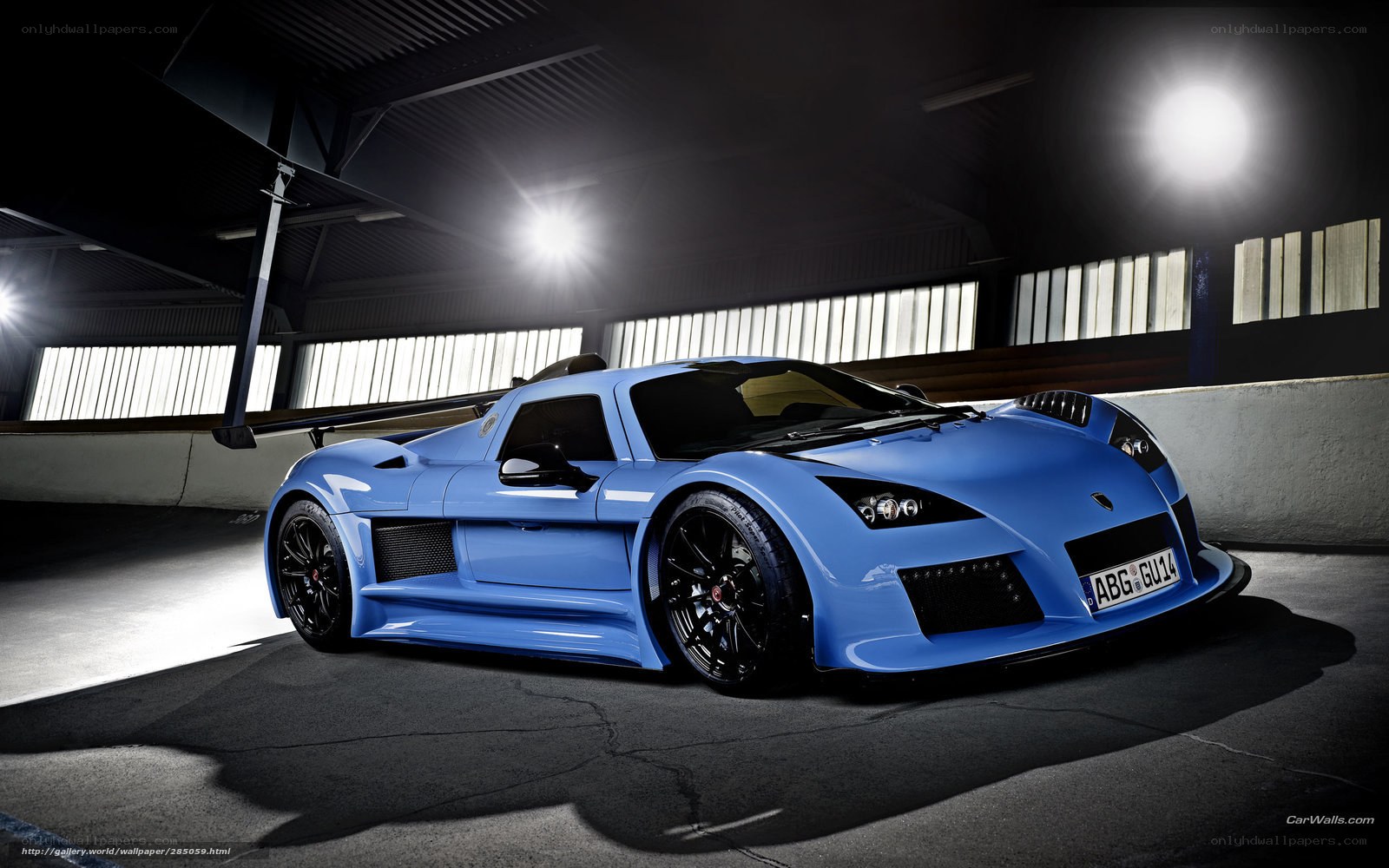 blue sports car in garage