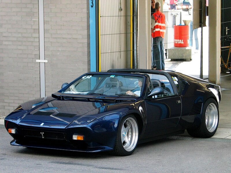 blue sports car in garage