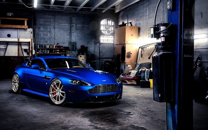 Blue sports car in garage