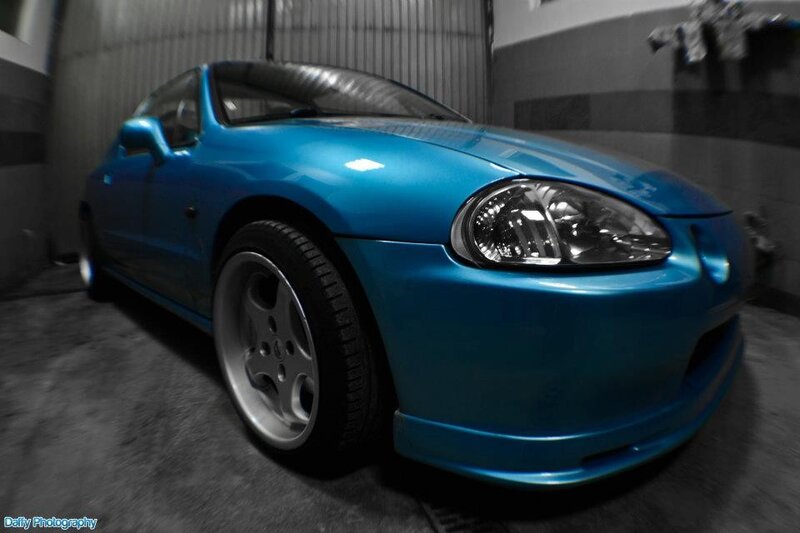 blue sports car in garage