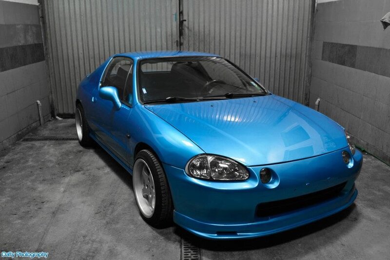blue sports car in garage