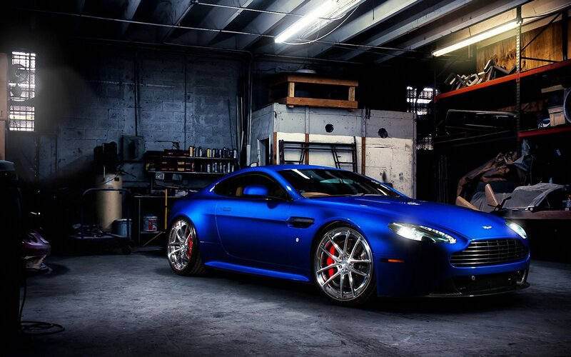 Blue sports car in garage