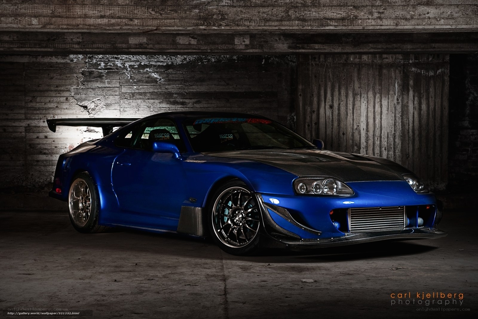 blue sports car in garage