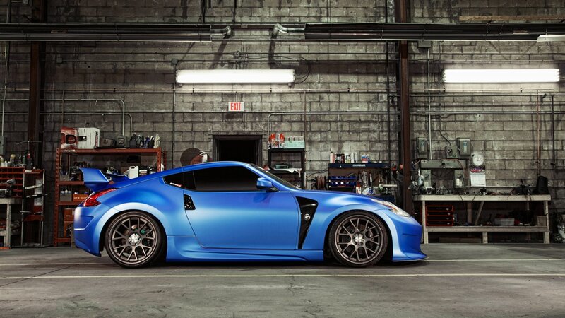 Blue sports car in garage