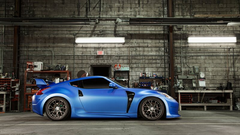 Blue sports car in garage