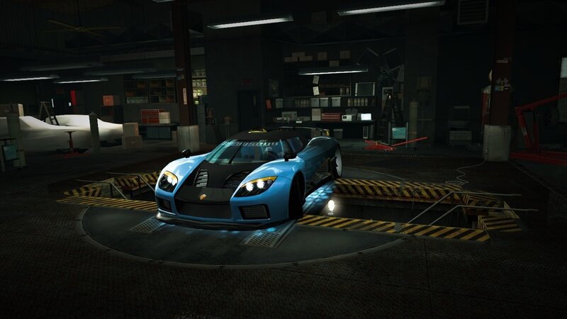 blue sports car in garage