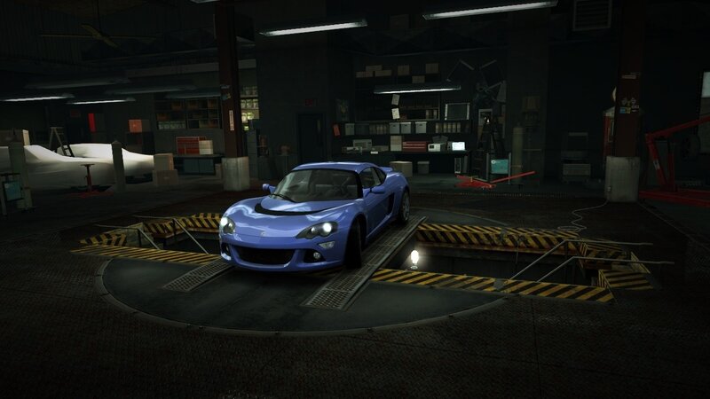 blue sports car in garage