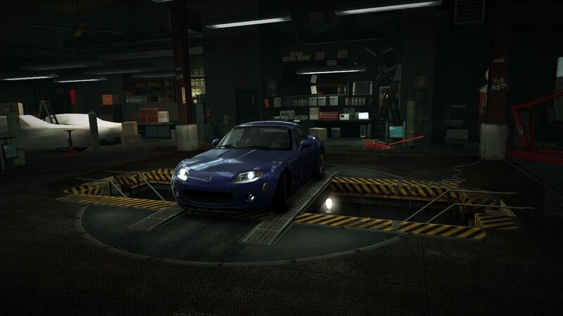 blue sports car in garage
