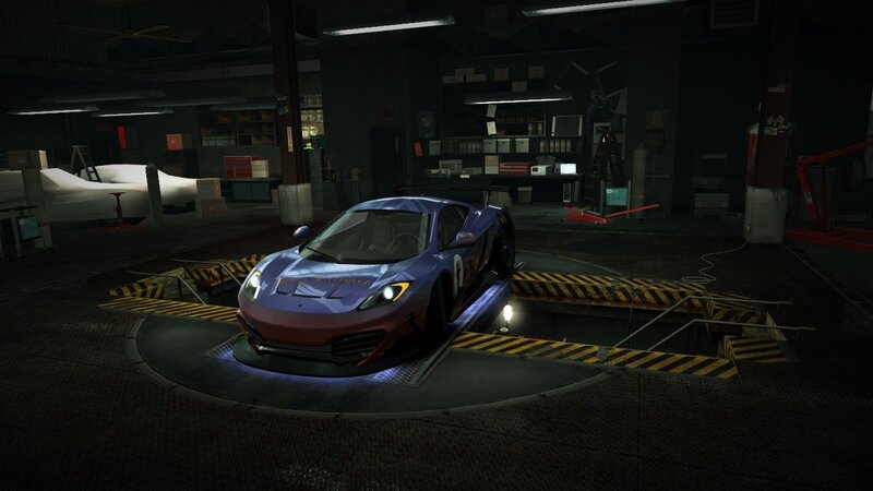 blue sports car in garage