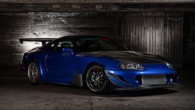 blue sports car in garage