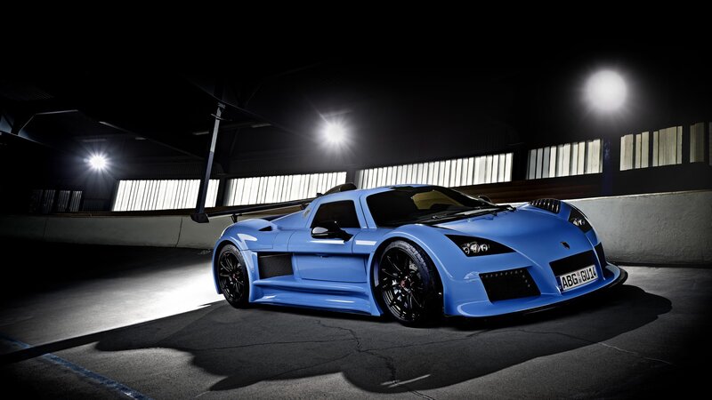 blue sports car in garage