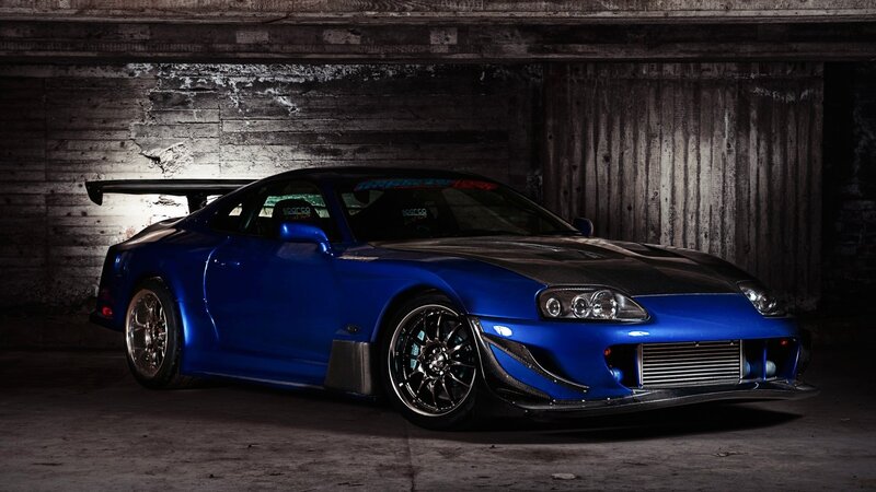 blue sports car in garage