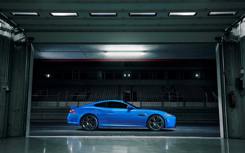 Blue sports car in garage