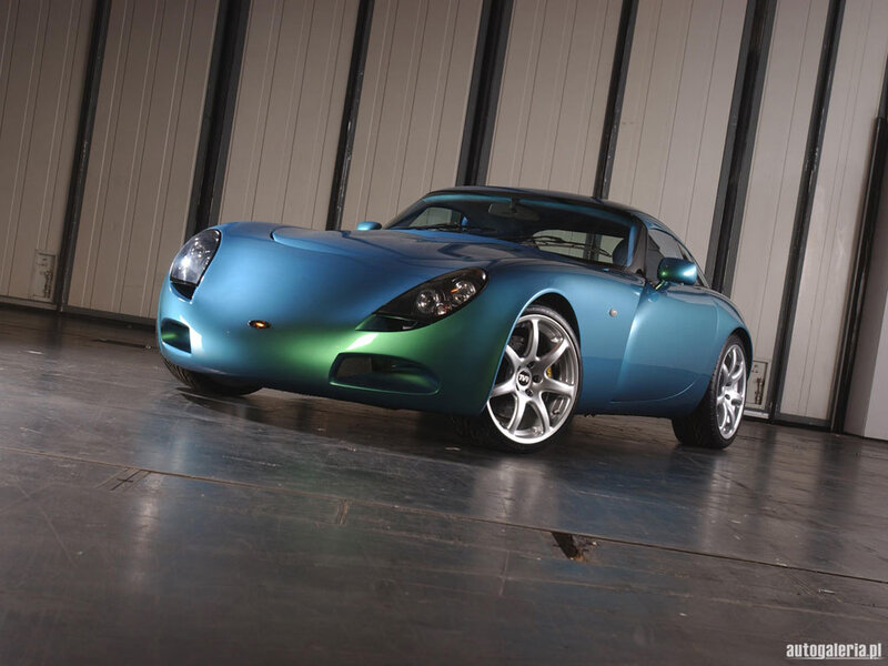 blue sports car in garage