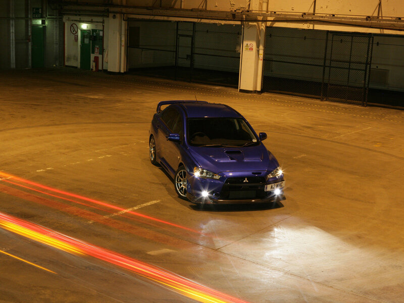 blue sports car in garage