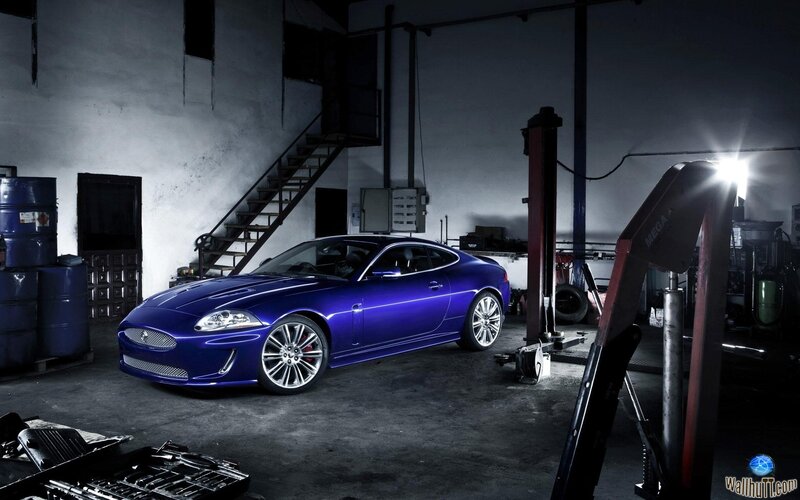 Blue sports car in garage