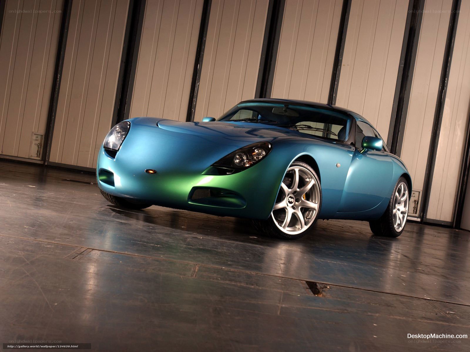 blue sports car in garage