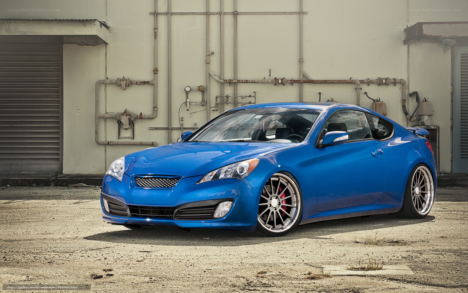 blue sports car in industrial setting
