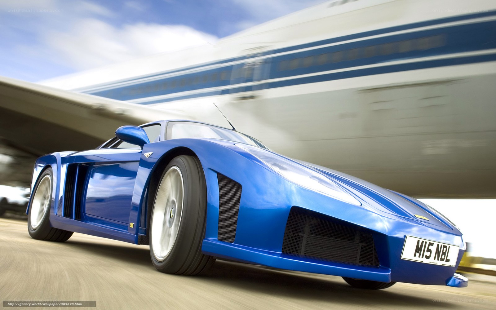 blue sports car in motion