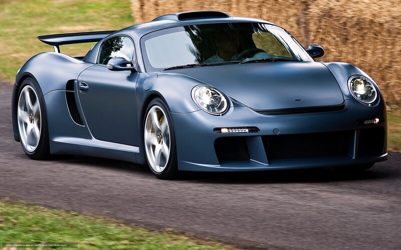 blue sports car in motion