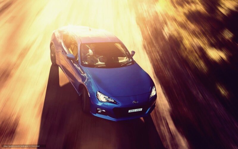 blue sports car in motion