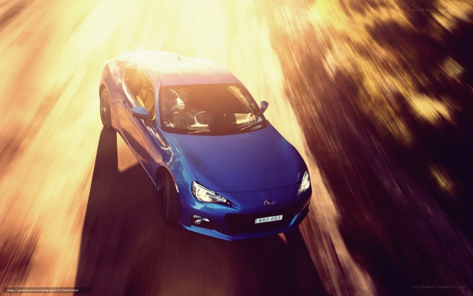 blue sports car in motion