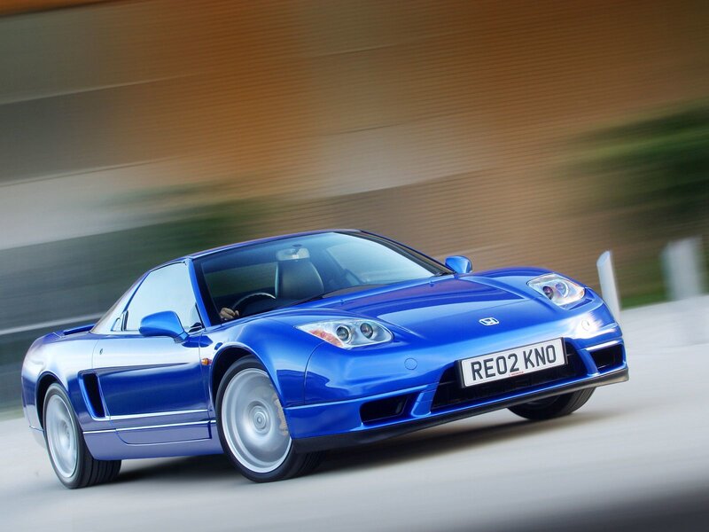Blue sports car in motion