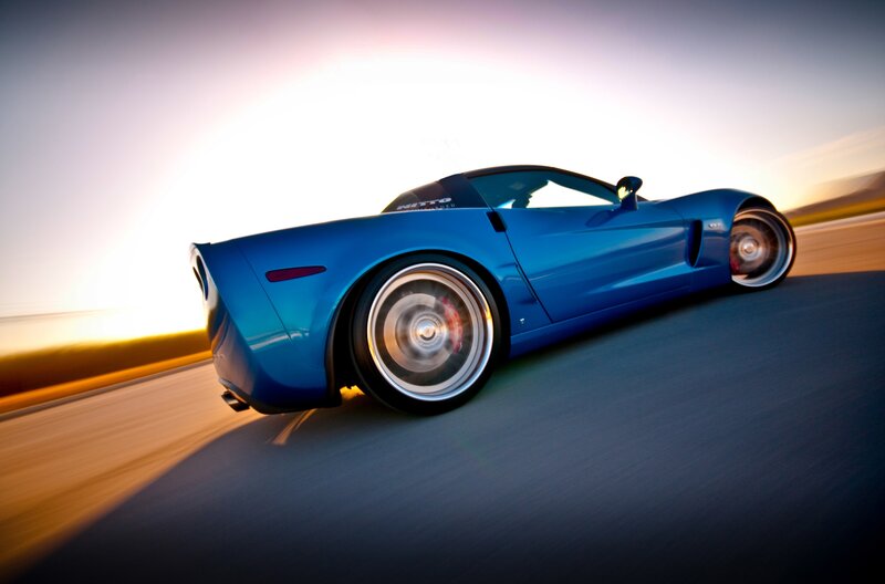 Blue sports car in motion