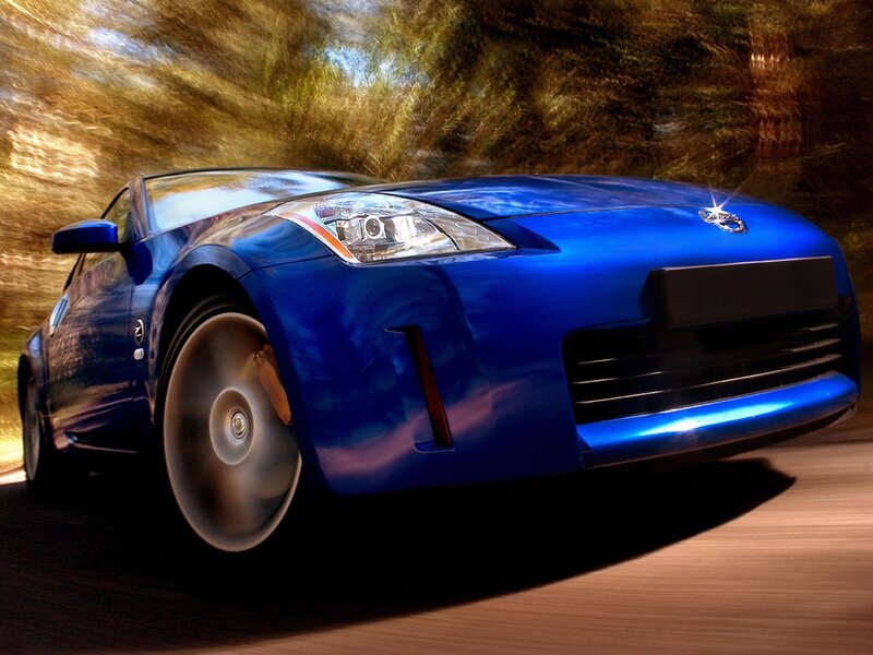 Blue sports car in motion