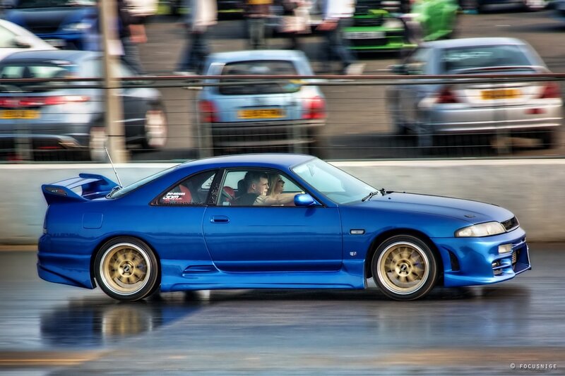 Blue sports car in motion