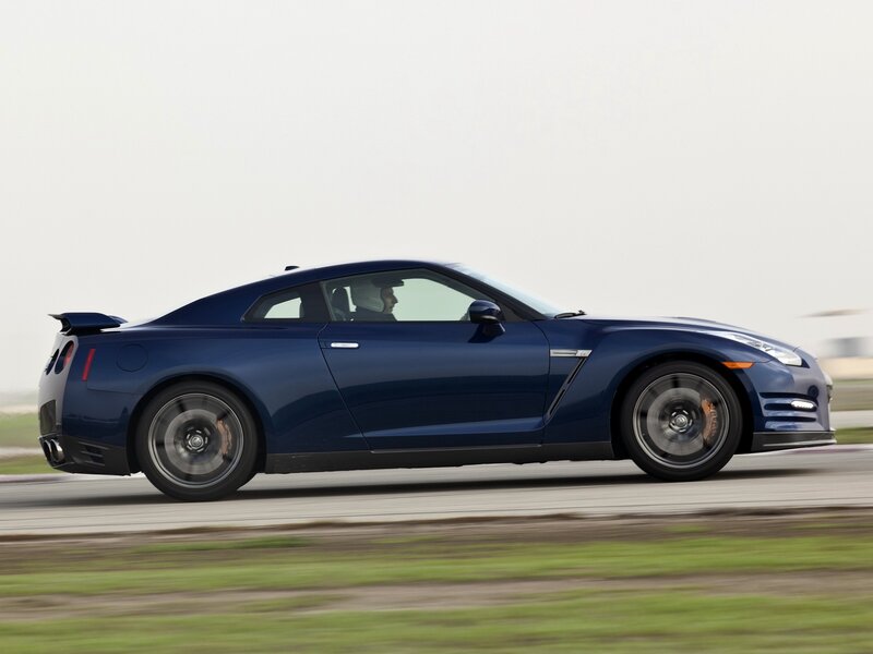blue sports car in motion