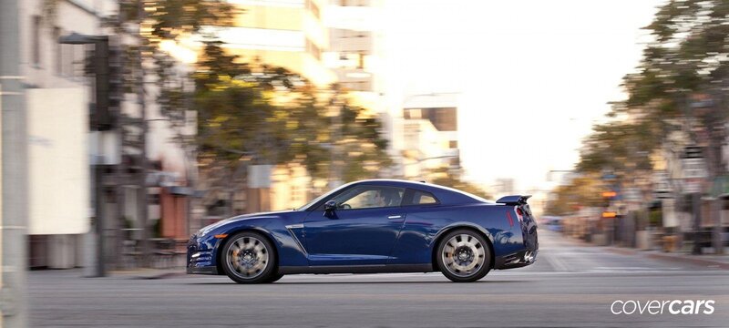 blue sports car in motion