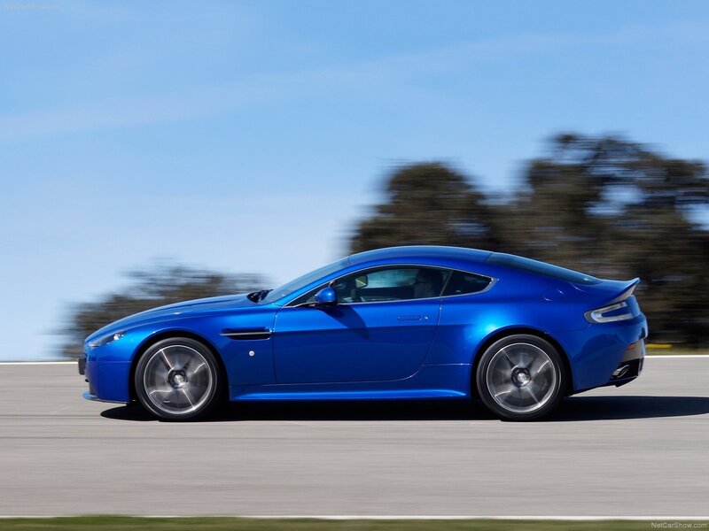 blue sports car in motion