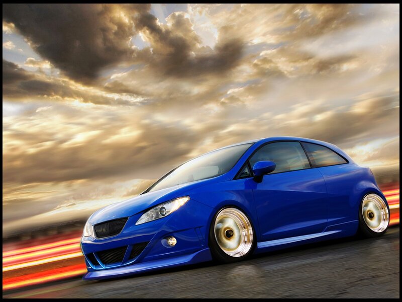 Blue sports car in motion
