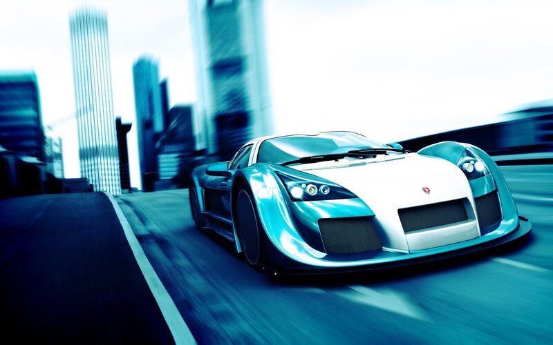 blue sports car in motion