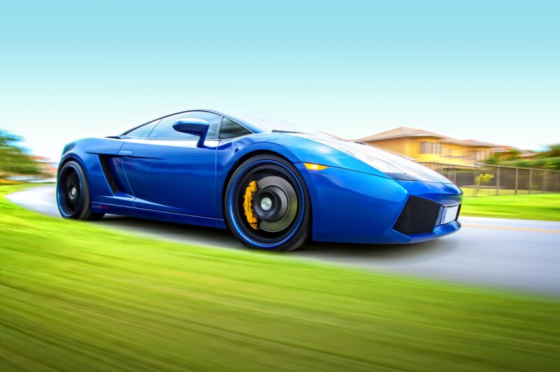 blue sports car in motion