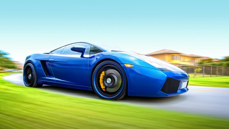 blue sports car in motion