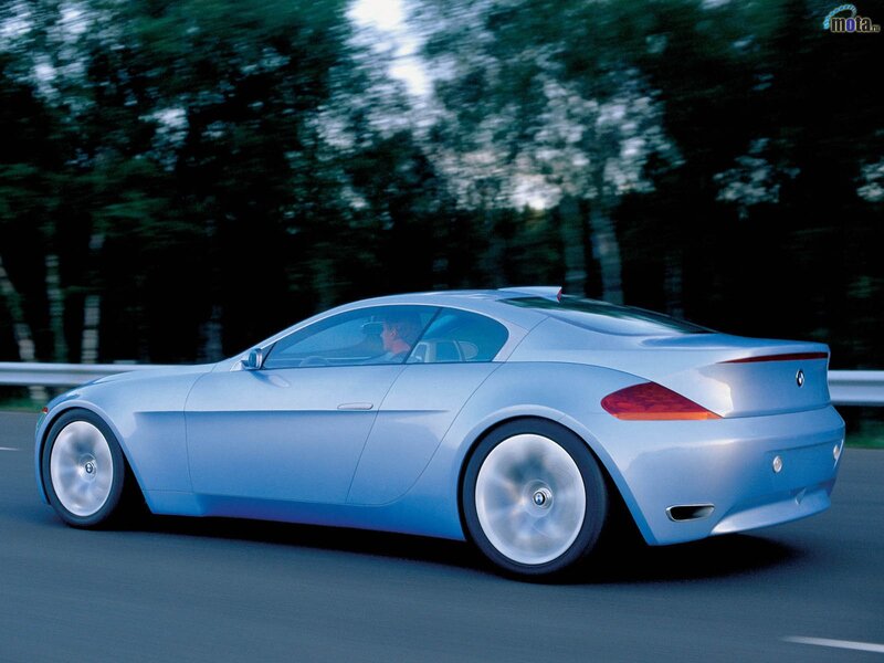 blue sports car in motion
