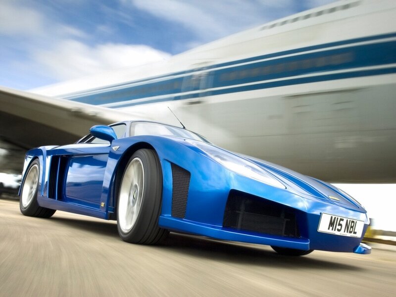 Blue sports car in motion