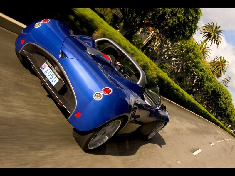 Blue sports car in motion