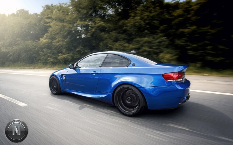 blue sports car in motion