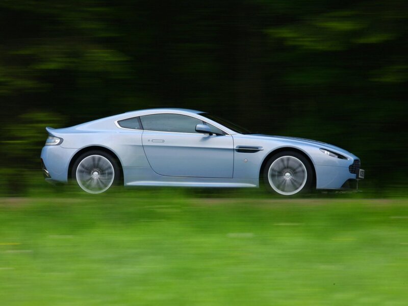 blue sports car in motion