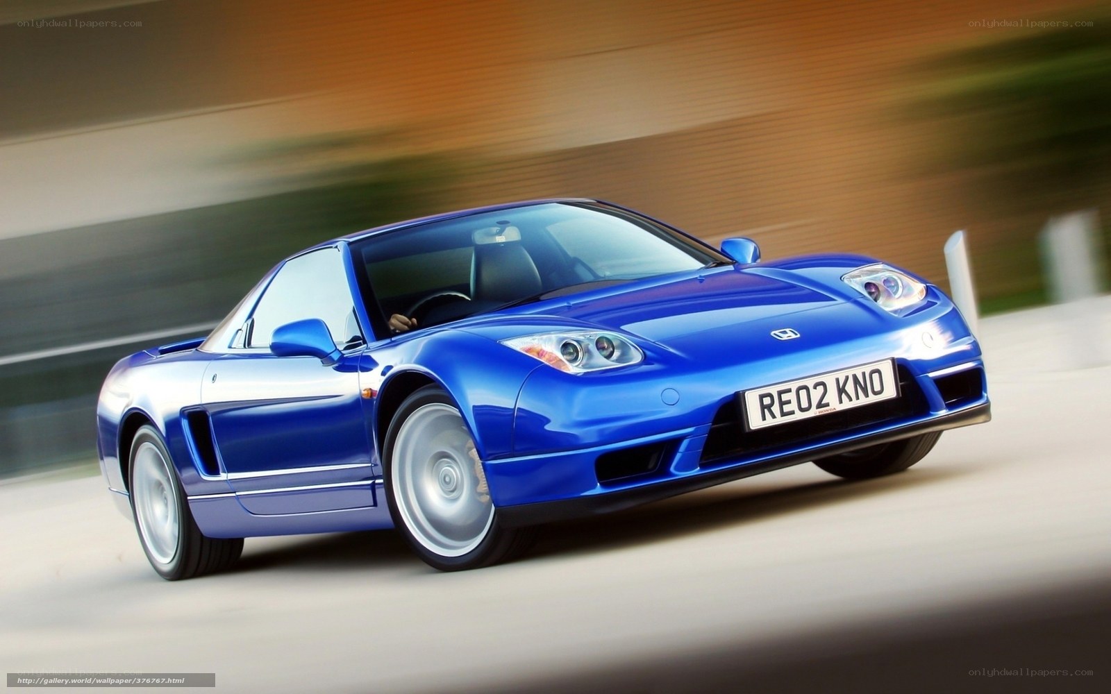 blue sports car in motion