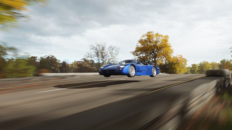 Blue Sports Car in Motion — Dynamic